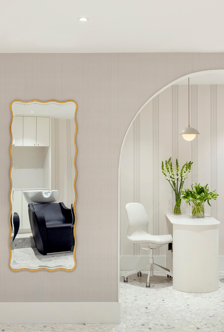 Wish Dry Bar Vancouver interior with wavy mirror and archway