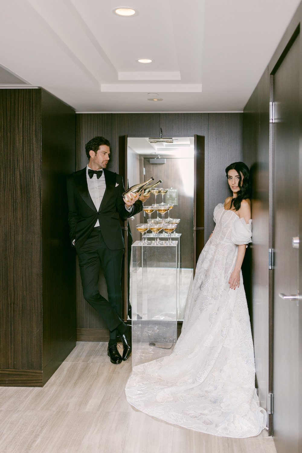 Textured bridal updo with loose tendrils perfect for outdoor wedding ceremony