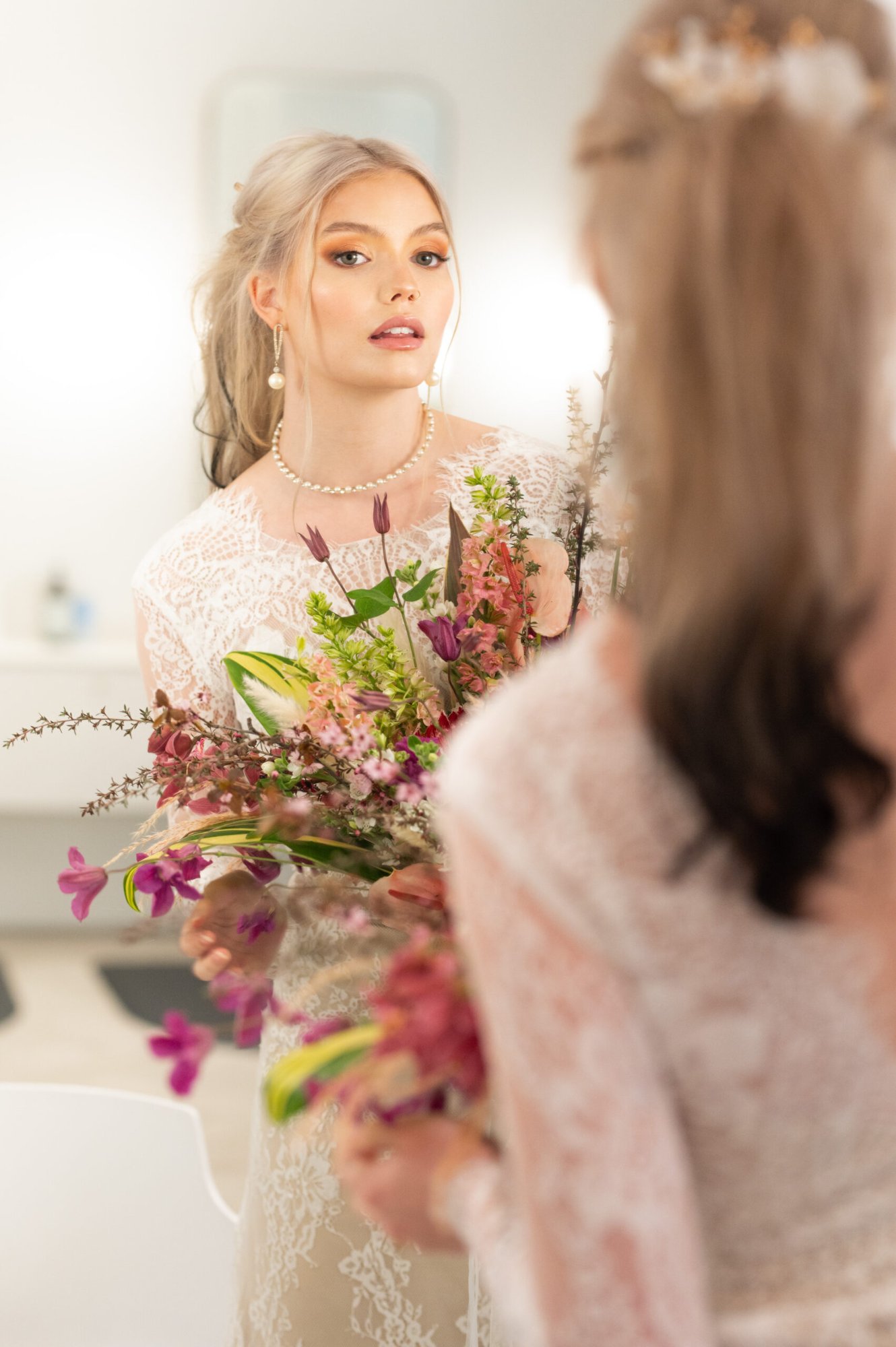 Soft bridal waves with delicate hair accessories for timeless wedding look