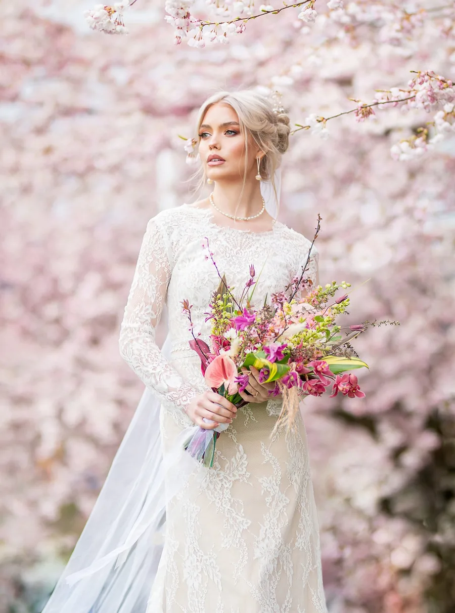 Elegant bridal hairstyle with pearl accessories and loose curls for special day